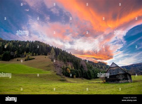 Old Barn At Sunset With Clouds Stock Photo - Alamy