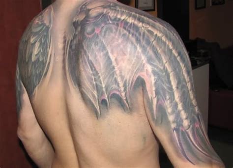 Fantasy world style colored big bat wings tattoo on shoulders ...