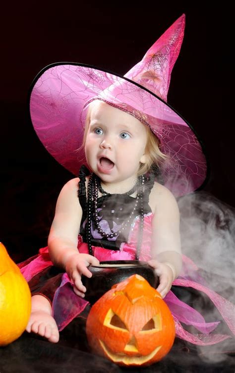 Halloween Baby Witch With A Carved Pumpkin Stock Photo - Image of ...