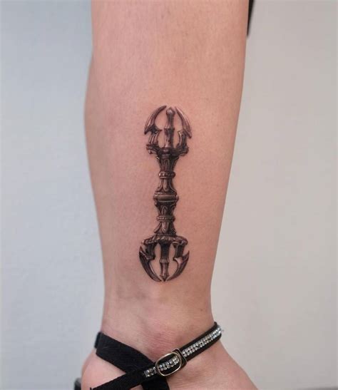 Vajra tattoo located on the shin, micro-realistic