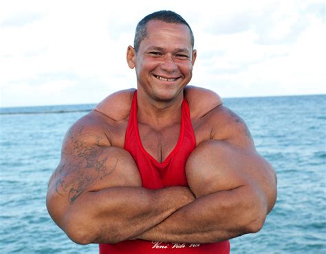 Bodybuilder Blows Arms Out With Oil Injections