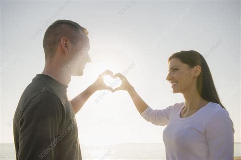 Couple making heart shape with hands - Stock Image - F006/4437 ...