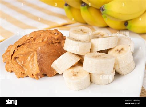 A stack of healthy banana slices with peanut butter adds healthy carbs ...