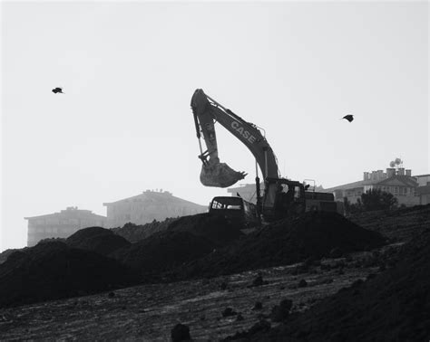 Digger Machine on Hill on Construction Site · Free Stock Photo