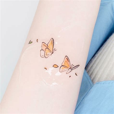 Small Yellow Butterfly Tattoo: A Symbol of Joy and Transformation ...