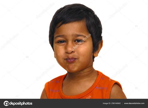 Handsome Indian Kid Playing Pranky Face Stock Photo by ©YAYImages 258144942