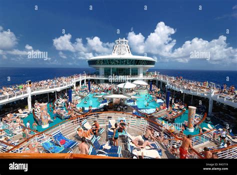 The pool deck on Royal Caribbean's Adventure of the Seas cruise ship is ...