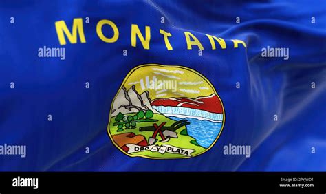 Close-up of Montana state flag waving. Blue flag with coat of arms in ...