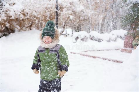 Cute Child Playing in a Snow. Winter Activities for Kids. Stock Image ...