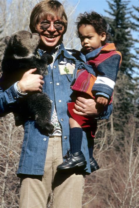 John Denver with his adopted son Zachary and a bear cub in the Rockies ...