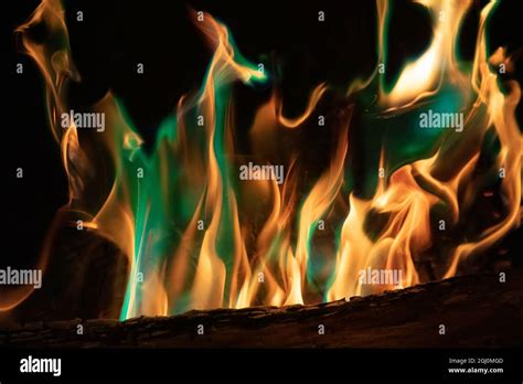 Colorful flames in a fireplace Stock Photo - Alamy