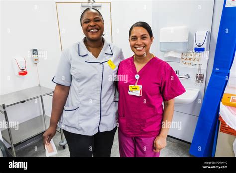 England, London, Smiling NHS Nurses in Uniform Stock Photo - Alamy