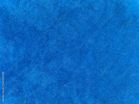 Light blue velvet fabric texture used as background. Empty light blue ...