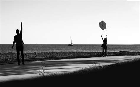 Man and Woman Flying a Kite · Free Stock Photo