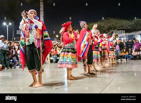 Dancers in colourful costumes performing traditional Huayno Cusqueño ...