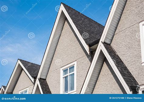 Top of the House with Dormer in the Blue Sky. Houses with Shingle Roof ...