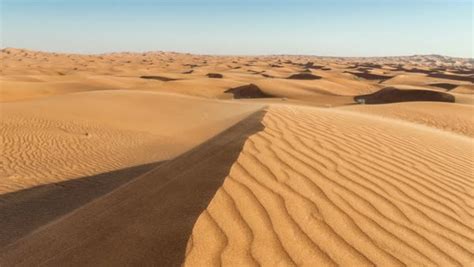 Timelapse shot of sand dunes at sunrise, Arabian Desert, Dubai, UAE ...