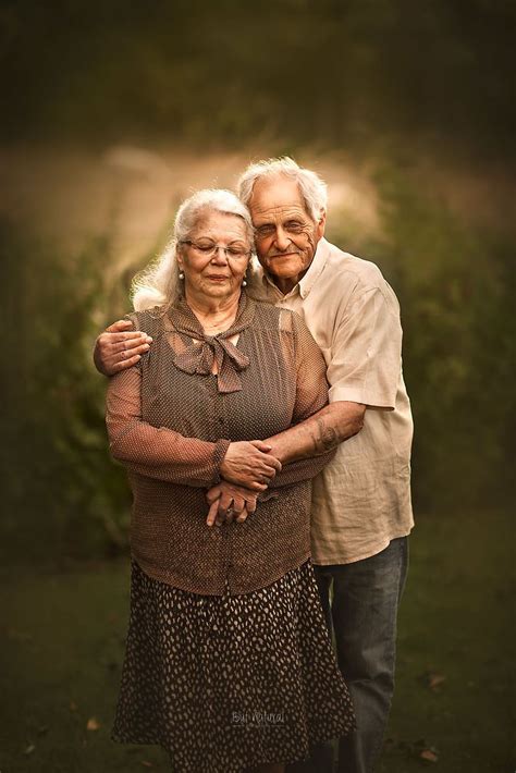 an older couple is posing for a photo