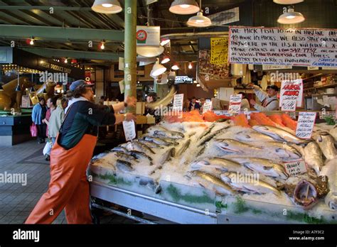 Pike Place Fish Market fishmonger throwing fish Pike Place Market ...