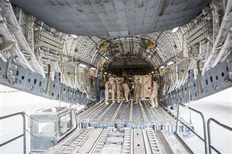 Equipment is loaded into the cargo bay of a C-17 Globemaster - PICRYL ...