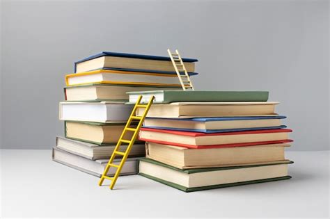 Free Photo | Front view of stacked books and ladders for education day