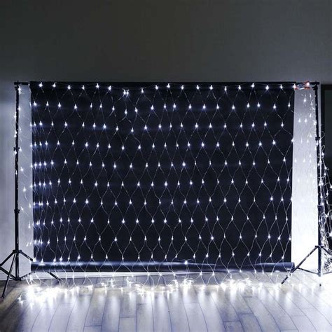 the backdrop is decorated with white lights