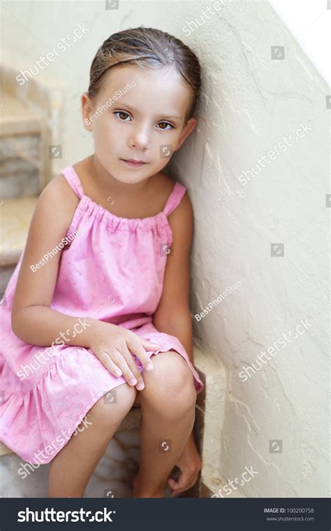 Photo de stock Beautiful Little Girl Pink Dress Sitting 100200758 ...