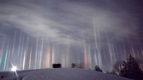 Photographer Captures Rare Light Pillars as They Illuminate the Night Sky