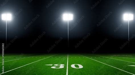 Football field illuminated by stadium lights Stock Photo | Adobe Stock