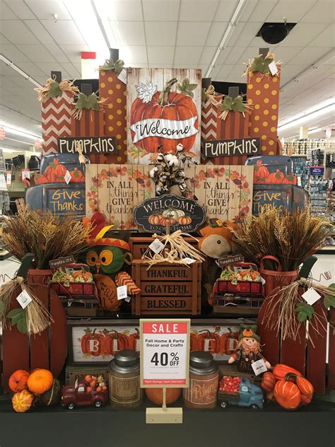 a display in a store filled with lots of pumpkins and gourmet items