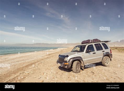 Off road car on the beach Stock Photo - Alamy