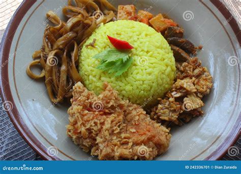 Yellow Rice with Various Indonesian Side Dishes Stock Image - Image of ...