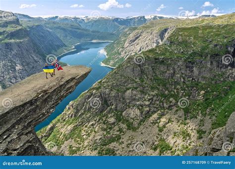 Odda, Norway: Tourists with Flags of Norway and Ukraine on Trolltunga ...