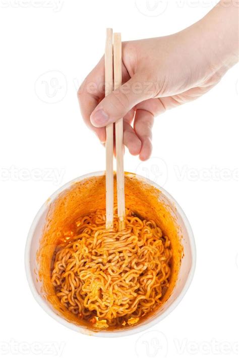 hand keeps chopsticks in prepared instant noodles 11185309 Stock Photo ...