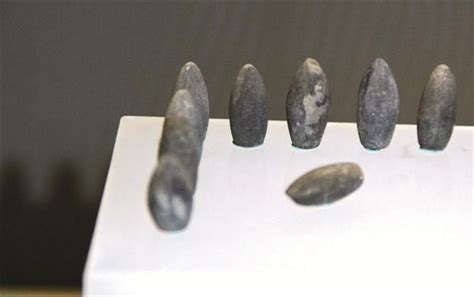 A group of playing pieces that have been unearthed in excavations in ...