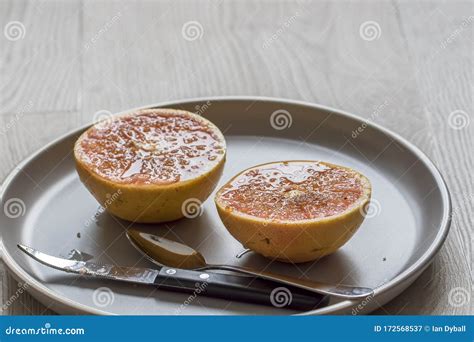 Grilled Grapefruit with Curved Grapefruit Knife and Spoon Stock Image ...