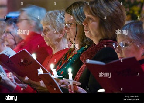 Congregation singing and holding candles during filming of BBC Songs of ...