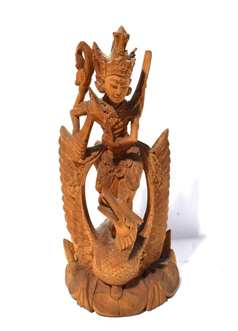 Lot - An Indonesian Wood Carving of Sarasvati