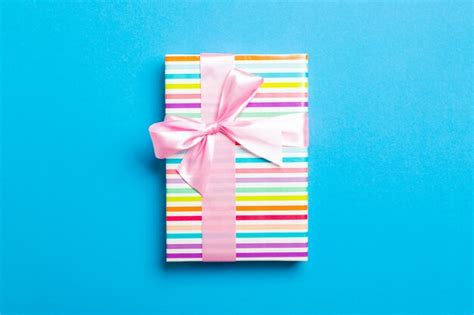 Premium Photo | Wrapped gift box with ribbon