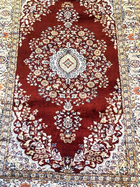 TURKISH PURE SILK RUG, 180cm x 119cm, floral medallion within multiple ...