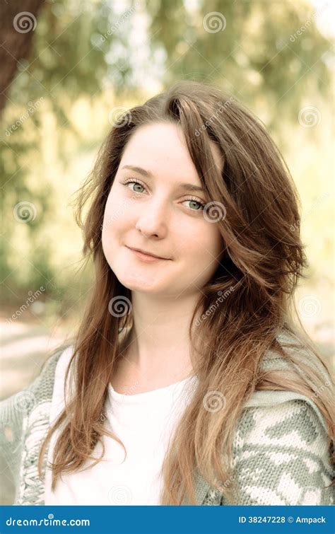 Attractive Young Woman with an Amused Smile Stock Photo - Image of ...