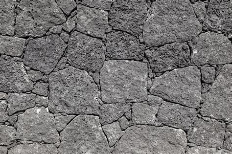 Texture of the black volcanic rock wall from Lanzarote, Canary ...