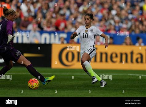 The United States' Carli Lloyd, right, scores past Ireland goalkeeper ...