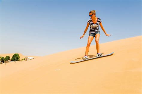 How to try sandboarding on sand dunes in Dubai