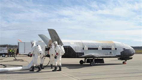 Space plane X-37B lands at NASA's Kennedy Space Center in Florida