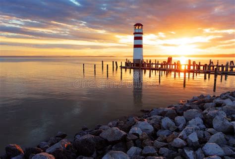 Ocean Sunset with Lighthouse Stock Photo - Image of lake, europe: 37930774