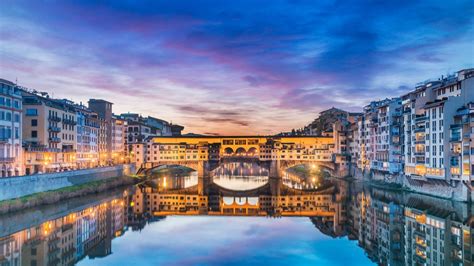 View of Ponte Vecchio bridge at sunrise, Florence, Firenze, Tuscany ...