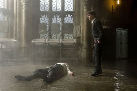 Draco lying on the bathroom floor after Harry's curse