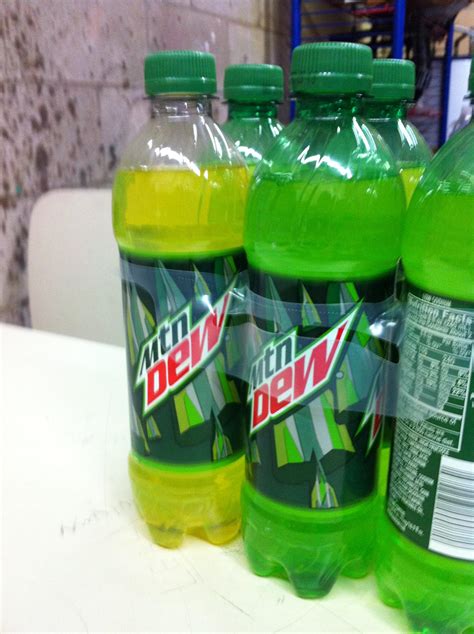 A clear Mountain Dew bottle in a 6 pack : mildlyinteresting