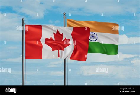 India flag and Canada flag waving together on blue sky, two country ...